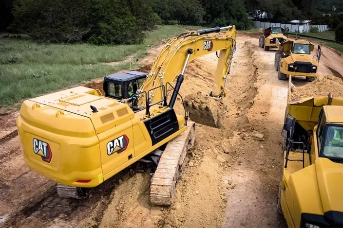 CAT excavator performing mass excavation and foundation digging in Kansas City